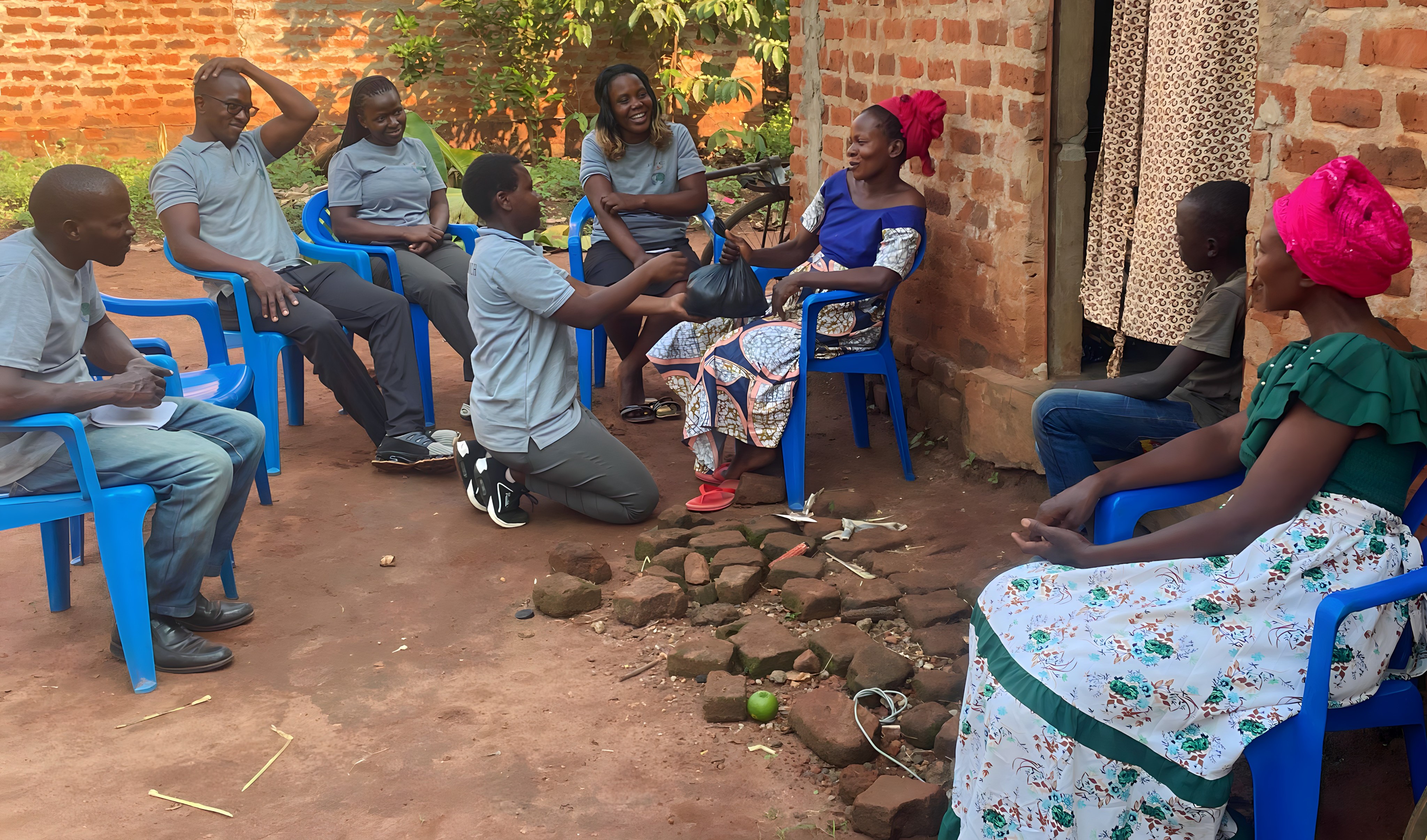 Community gathering in prayer circle with church members