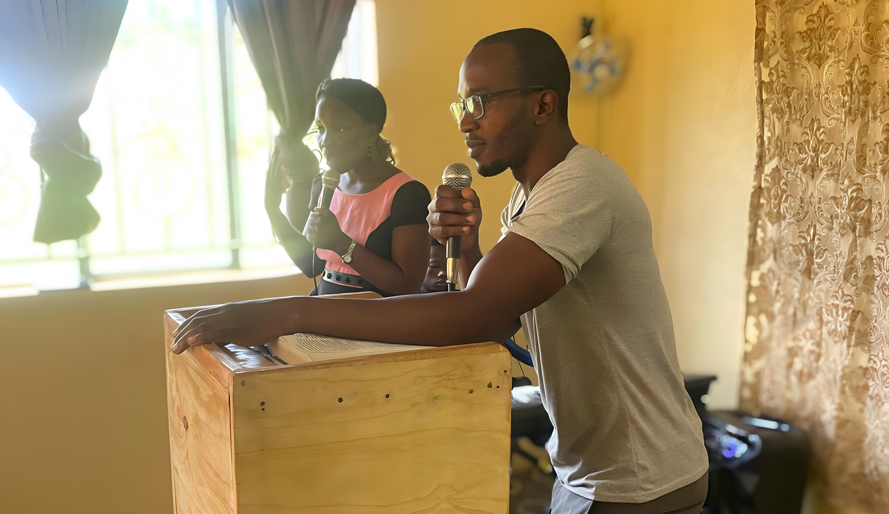 Pastor and church members leading worship service